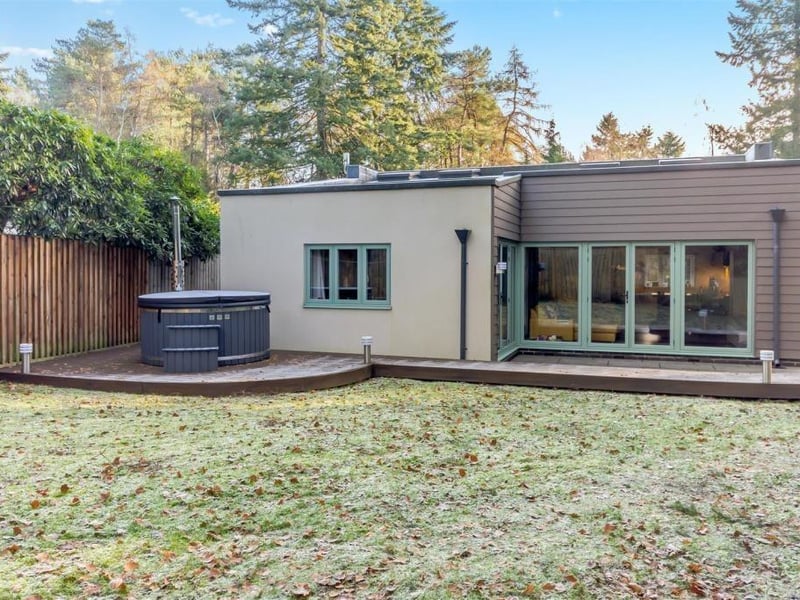 Time to step outside again now, and this is a side-on shot of the exterior of the £645,000 property. The hot tub is available to buy through separate negotiation.
