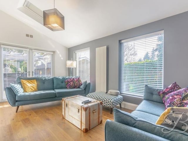 A second shot of the living room, which is the ideal place to spend some quality time with the family. French doors lead out to the garden.