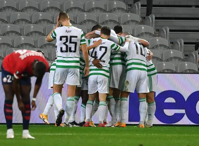 Celtic players celebrate as their side race into a 2-0 lead in Lille. Picture: SNS