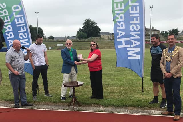 Ted Grey, Hurdles Coach, is presented with a volunteer award by England Athletics East Midlands.