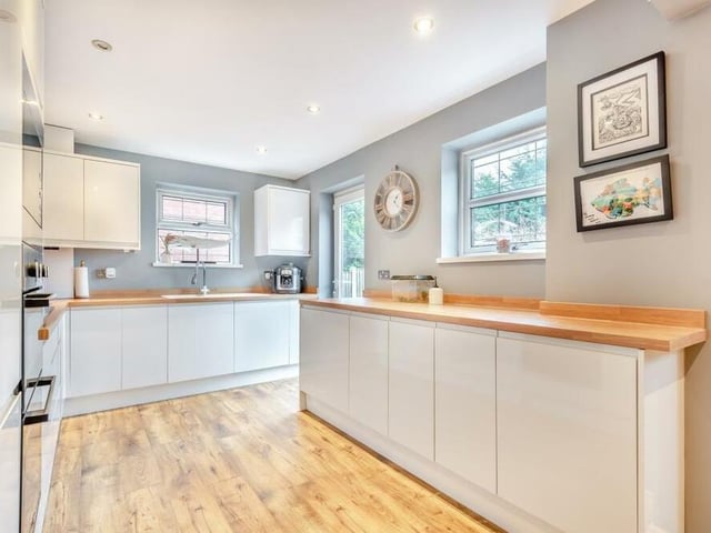 Classy finishing touches, such as a vinyl floor and 12 ceiling spotlights, add to the appeal of the kitchen/diner. There are windows to the rear and side, while a patio door leads out to the back garden.