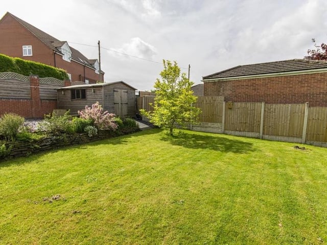As we say farewell to the Glapwell bungalow, here is one final shot of the exterior at the back. A handy garden shed is tucked away in the corner, accessible via a paved ramp.