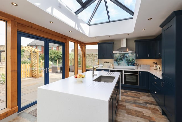 The stone-built kitchen has an orangery-style roof lantern.