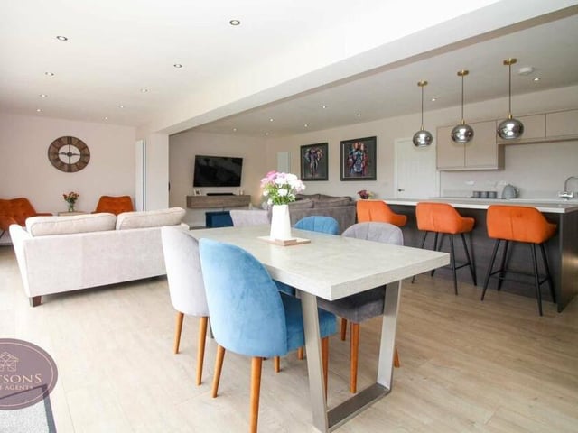 A view of the open-plan area from the breakfast table, or dining table, in the kitchen.