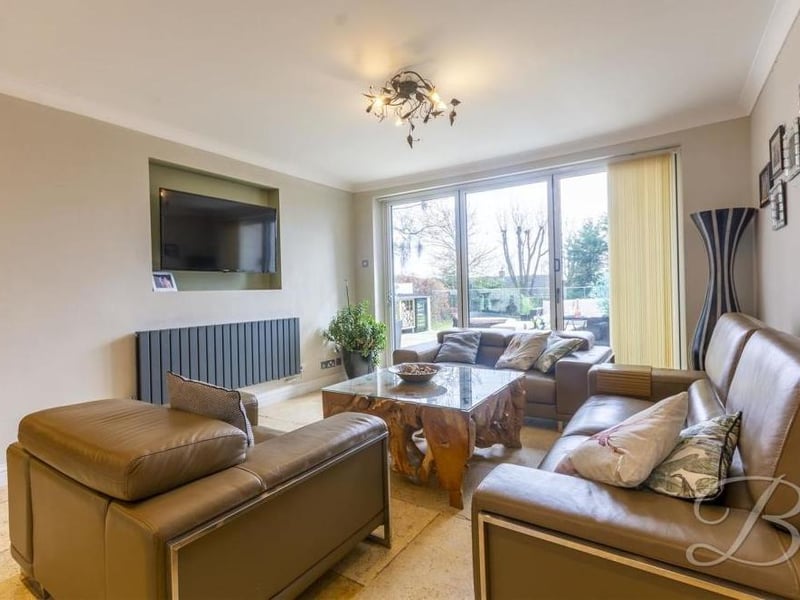 This is the open-plan lounge or living area that attaches itself to the kitchen., with views of and access to the back garden.