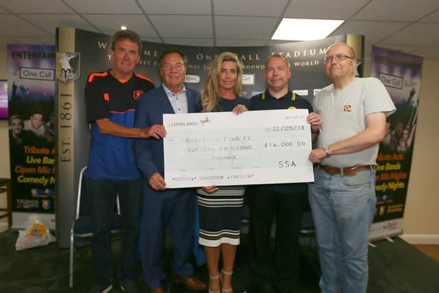 SSA members hand over a donation back in May 2018.