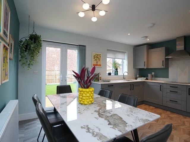 The Medwin at Ravenswood Reach is an attractive two-bedroom detached bungalow, thoughtfully designed to combine modern style with easy, practical living. At the heart of the home is a bright and spacious open-plan kitchen, living and dining area, creating a welcoming space for both everyday living and entertaining. French doors open directly onto the private rear garden, allowing natural light to flood in and offering a seamless connection between indoor and outdoor living.