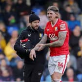 Mansfield Town defender Aden Flint (14) is injured during the Sky Bet League 2 match against AFC Wimbledon at Cherry Red Records Stadium, 27 Jan 2024 
Photo Chris & Jeanette Holloway / The Bigger Picture.media