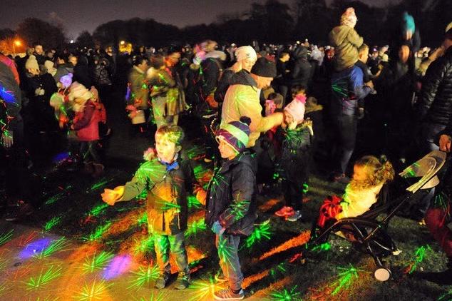 Children enjoying the dazzling light projections at the Mansfield Woodhouse fireworks, 2016