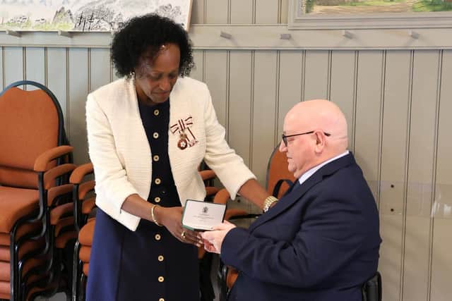 Peter Edwards being awarded his MBE by His Majesty’s Lord-Lieutenant of Nottinghamshire, Professor Veronica Pickering MBS HAC.