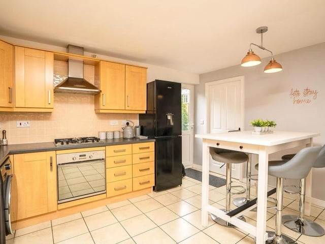 The breakfast kitchen from a different angle. There is space for a dishwasher, fridge/freezer and dining table, and there is also space and plumbing for a washing machine.