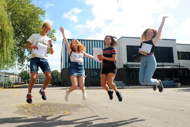 St Edmund's Catholic School students (l-r) Oliver Matthews (16), Grace Hargreaves (16), Louise Elliott (16) and Eloise Borrett (16), jump for joy with their results. Picture: Sarah Standing (200820-3040)