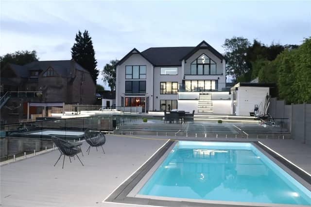The stunning heated outdoor pool, perfect for family fun or entertaining guests.