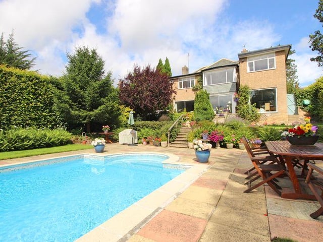 Looking back at the house from the outdoor swimming pool.