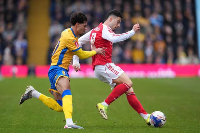 Mansfield Town's English midfielder #40 George Abbott (L) vies with Arsenal's Brazilian midfielder #11 Gabriel Martinelli (R) during the English FA Cup fifth round football match between Mansfield Town and Arsenal at the One Call Stadium, Field Mill in Mansfield, central England on March 7, 2026. (Photo by Jon Super / AFP via Getty Images)