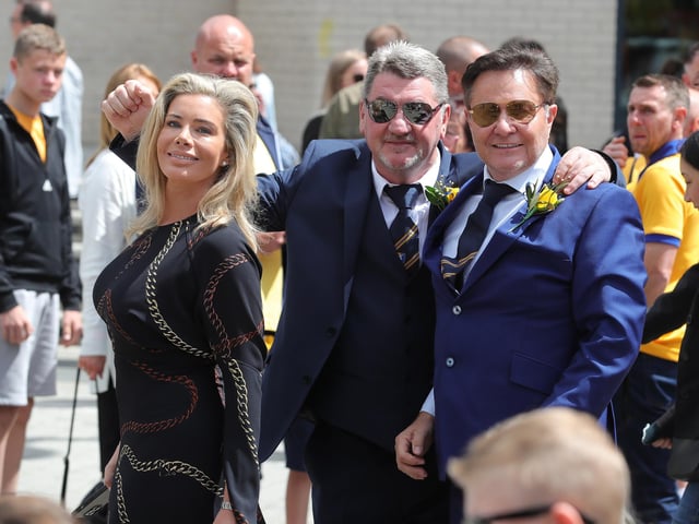 Carolyn Radford with Steve Hymas and husband John.