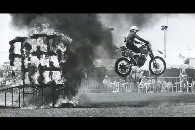 A Honda Imp jumping in between two walls of fire to impress the crowd of Southsea Show in August 1990. The News PP5193