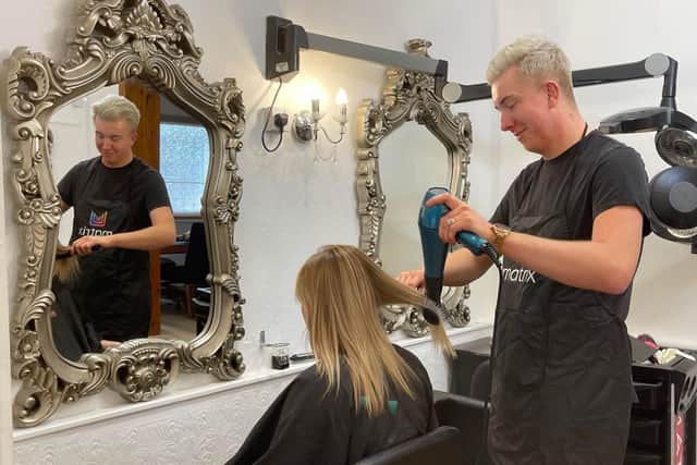 Kieren Edden-Hards at work in the salon.