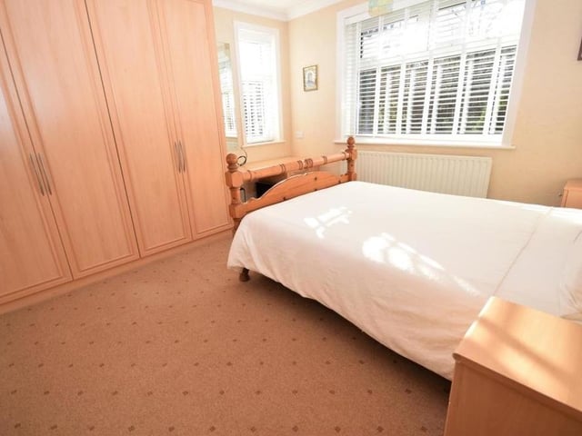 Comfort and style emanate from all the rooms in the Ravenshead house - and this bedroom, complete with its huge built-in wardrobes, is no different.