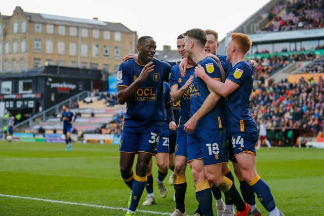 Stags celebrate Rhys Oates’s first half goal during the win at Bradford. They now have three key games ahead which could define the season.