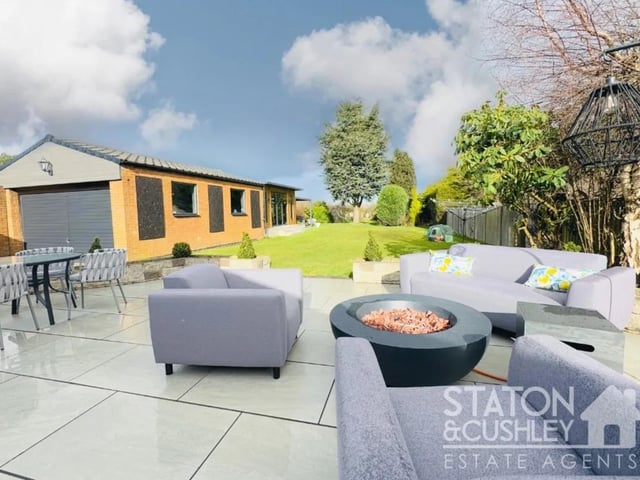 The garden boasts a stunning patio area, perfect for BBQs or outdoor entertaining.