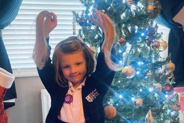Freya Wilmot with her hair cut off ready to be donated to The Little Princess Trust