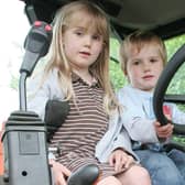 2008: Heidi Gooding, five, and Archie Gooding, three, are pictured in a tractor at Kimberley Primary School's summer fair.