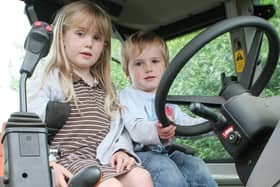 2008: Heidi Gooding, five, and Archie Gooding, three, are pictured in a tractor at Kimberley Primary School's summer fair.