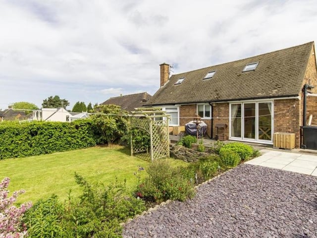 The back garden from a different angle, showing a decorative slate bed and also the large bi-folding doors that lead from the dining room.