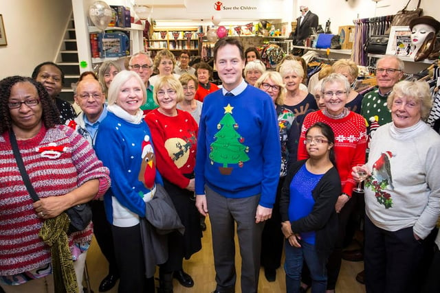 Deputy Prime Minister Nick Clegg poses for a photograph with volunteers in Sheffield's Save the Children shop  in 2014 to celebrate the shop's 25th anniversary. Nick Clegg is supported Save the Children's Christmas Jumper Day campaign