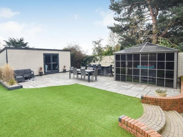 Here is a close-up of the ingenious 'pub shed' and fitted gazebo with hot tub in the back garden of the £575,000 property. Pretty cool, eh?