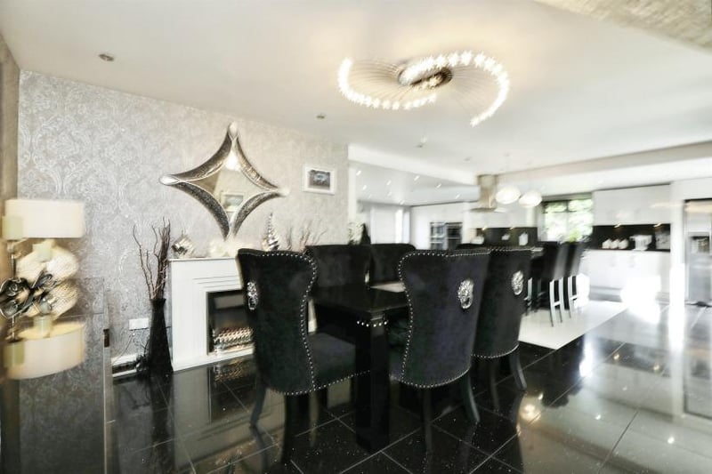 This classy dining area is part of one of the open-plan kitchens at the £2 million Firbeck property.