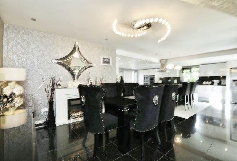 This classy dining area is part of one of the open-plan kitchens at the £2 million Firbeck property.