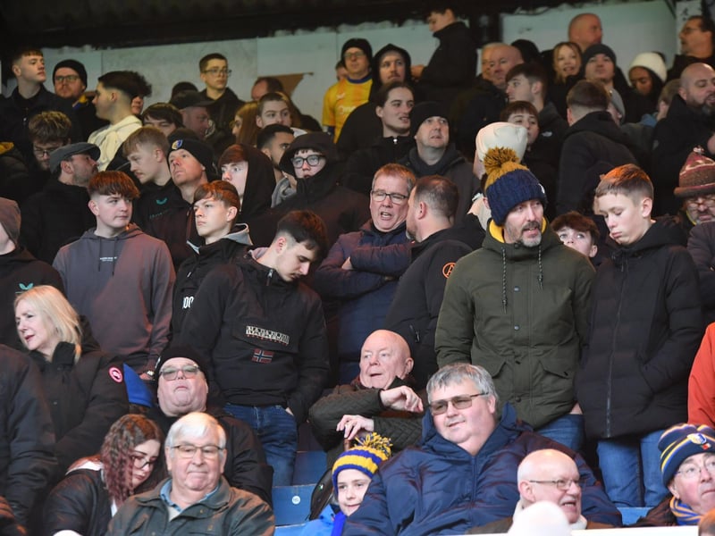 Mansfield Town fans watch the brilliant win at Peterborough United.