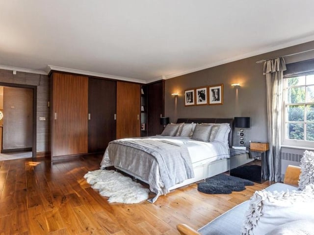 Up to the first floor now, and here is the superb principal bedroom, which has size and style about it. Features include bespoke fitted wardrobes and views over the lawn-tiered garden at the back of the £1.25 million property.
