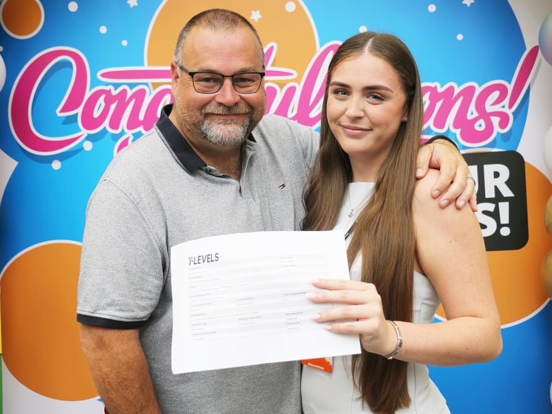 Sophie Stevenson and her dad Craig celebrate her distinction grade in the T Level in design, surveying and planning for construction course.