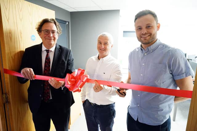 Coun Ben Bradley, right, opens the new building for Cowens with Paul Chapman, left, group chief executive officer, and Tony Duckworth, financial planning managing director.