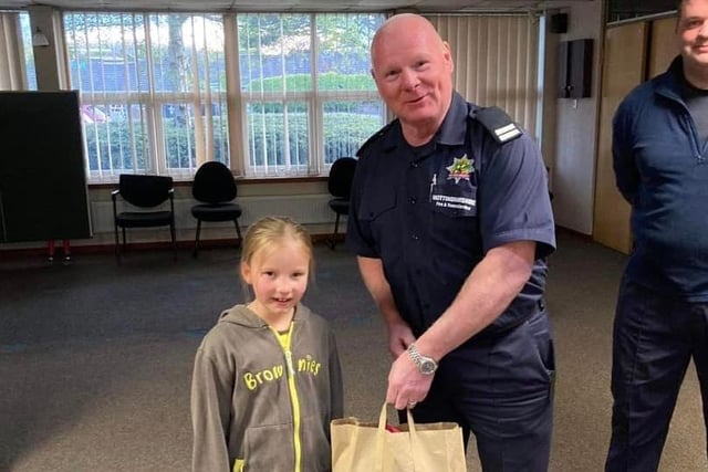 A Brownie received a gift from a firefighter.