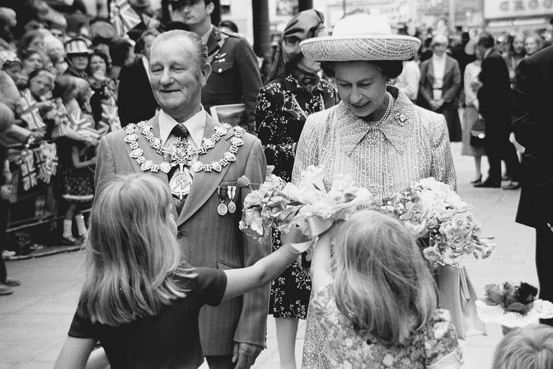 The Queen accepts a gift during her Silver Jubilee visit to Mansfield in 1977.