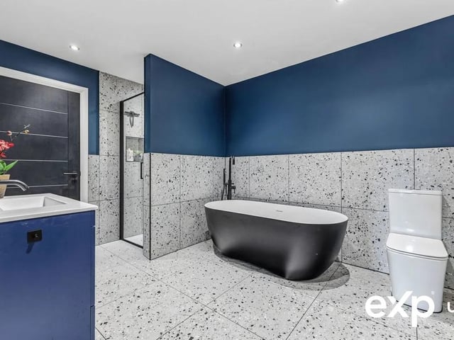 The family bathroom is the perfect space to unwind.