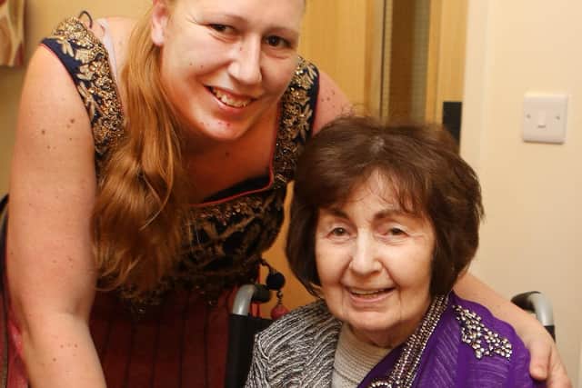 Senior carer Rebecca Musson, left, with resident Barbara Grime.