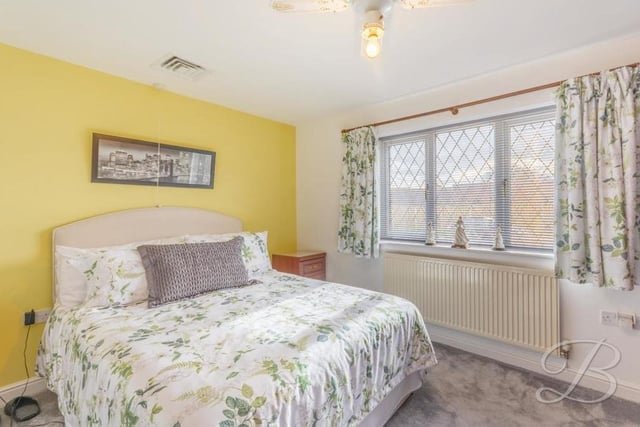 More bedroom comforts at Holly Drive. Extra warmth is provided by a carpeted floor and a central heating radiator.