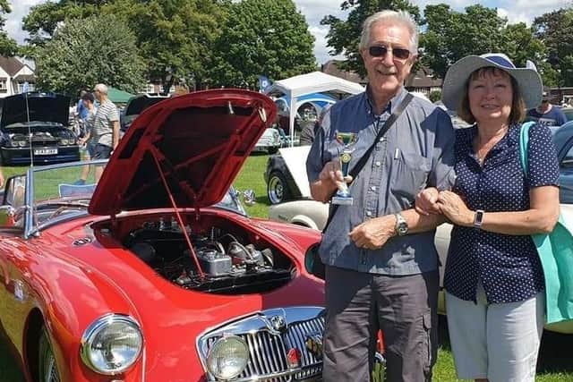 Pictured with one of his own classic cars and wife Sandra, retired engineer Pete Draycott, of Mansfield, who has organised the show in conjunction with the Nottingham Triumph Sports Six Club.