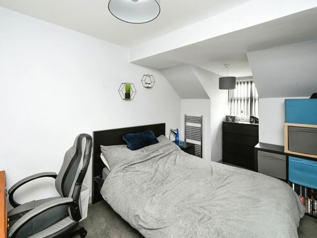 The next bedroom to look at has enough space for a desk, as well as storage.