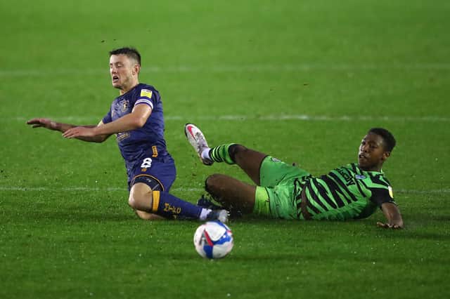Ollie Clarke is tackled by Ebou Adams during Mansfield's 2-1 win at Forest Green Rovers in November. (Photo by Michael Steele/Getty Images)