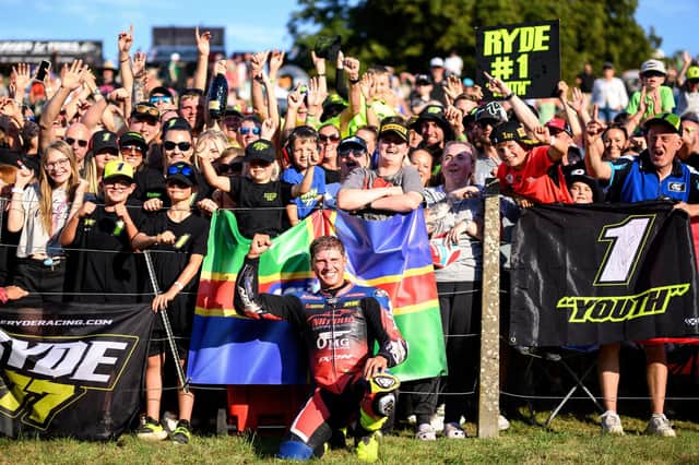 A delighted Kyle Ryde with his supporters at Cadwell Park. Photo by Michael Hallam.