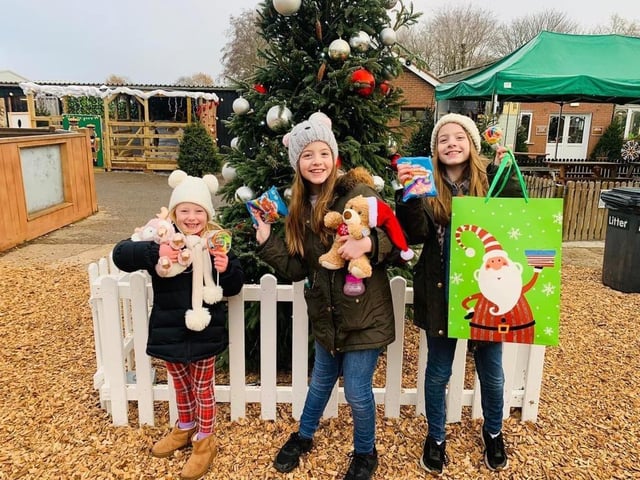 Visitors receive a gift from their Santa visit on the park.