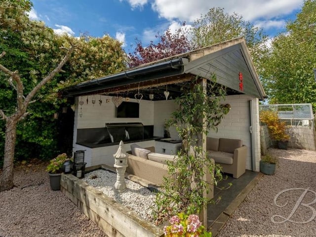 The garden is full of lovely seating areas in which to while away the hours. How about this covered one for entertaining family and friends during the summer?