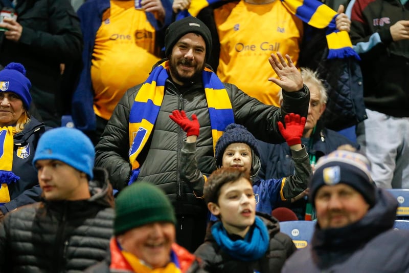 Mansfield Town's faces in the crowd against Swindon Town.
