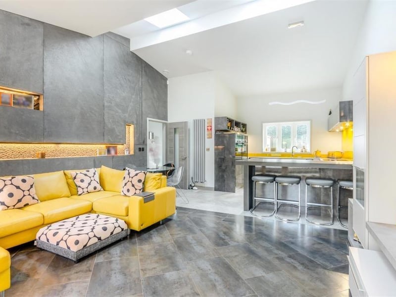 The first room we look at is the large open-plan living area and dining kitchen, which is a wonderful space.The living area features a Porcelanosa tiled floor, underfloor heating and two skylight windows.